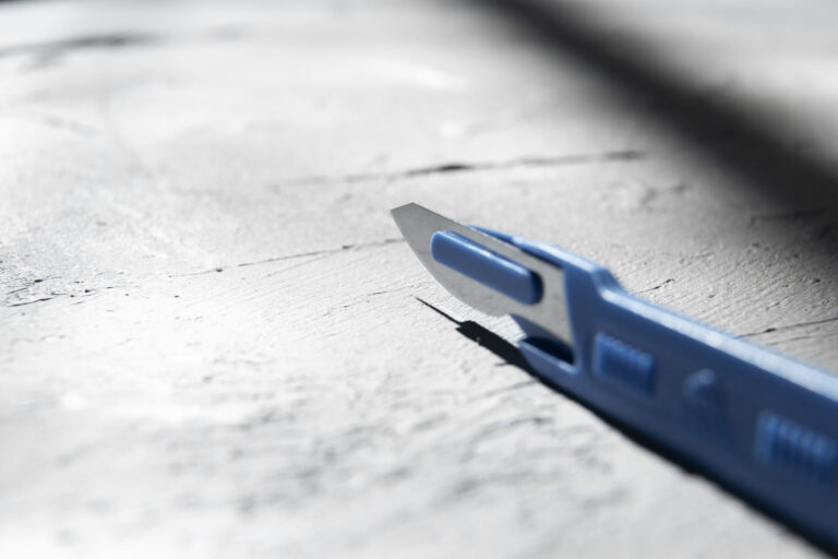 metallic medical scalpel with blade
