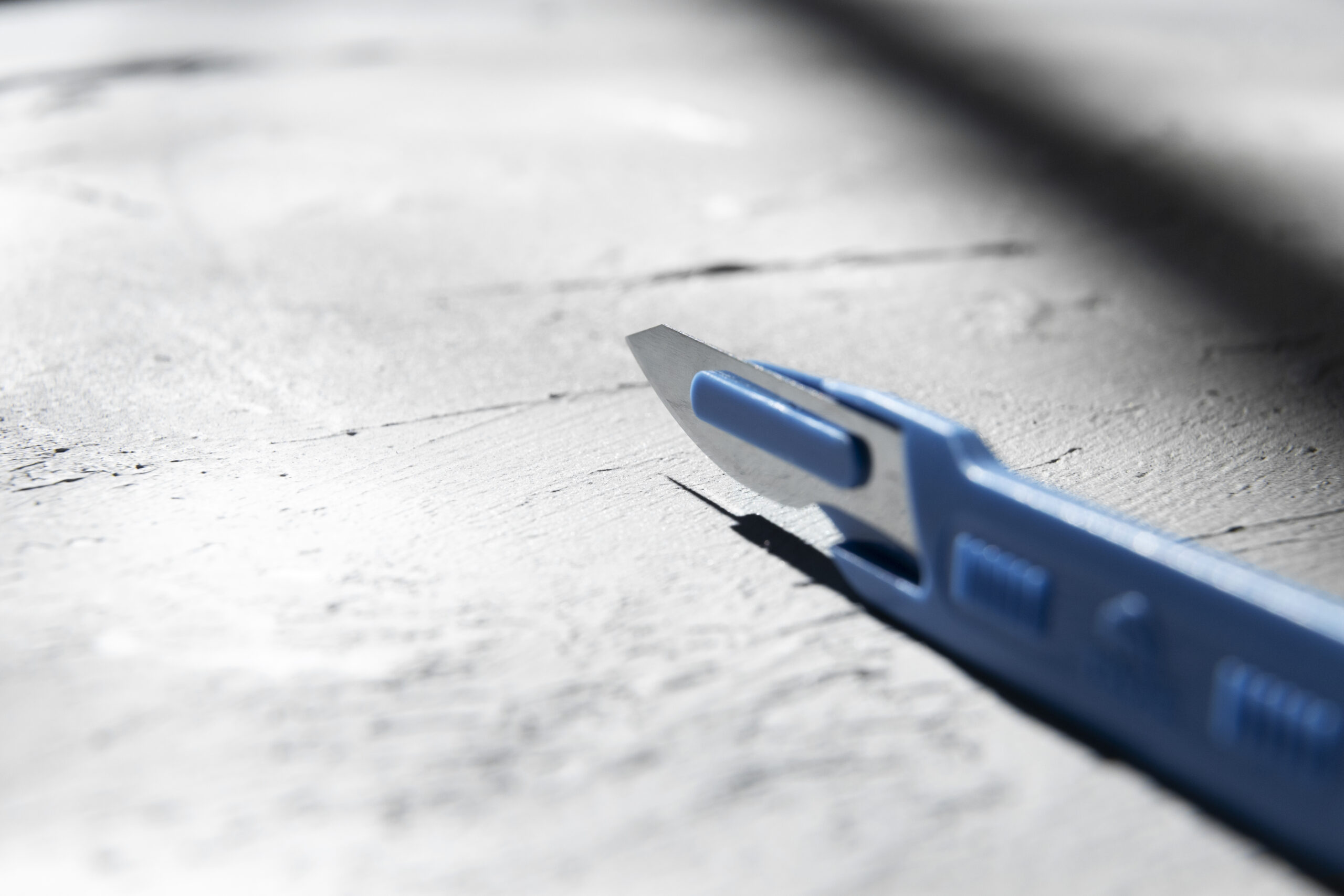 metallic medical scalpel with blade